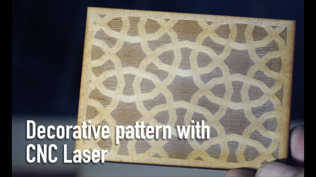 CNC Laser cuts decorative patterns on wood