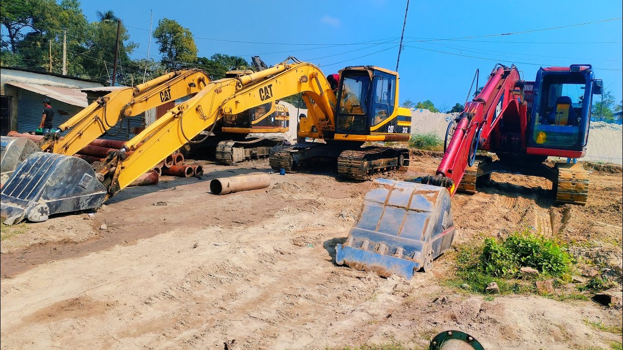 CAT 311Cu excavator loading by EICHER 1080xpt Dumptruck 