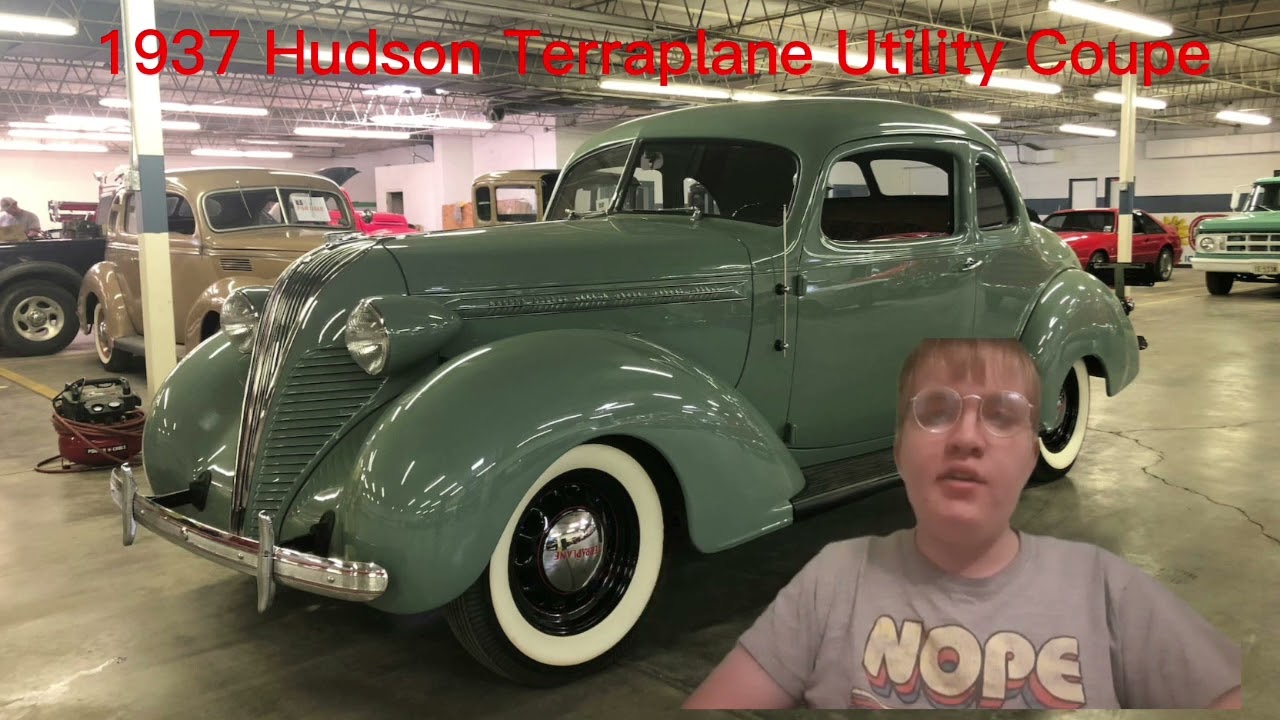 IN A BACKGROUND OF A 1937 HUDSON TERRAPLANE UTILITY COUPE (ROBINBEARE)