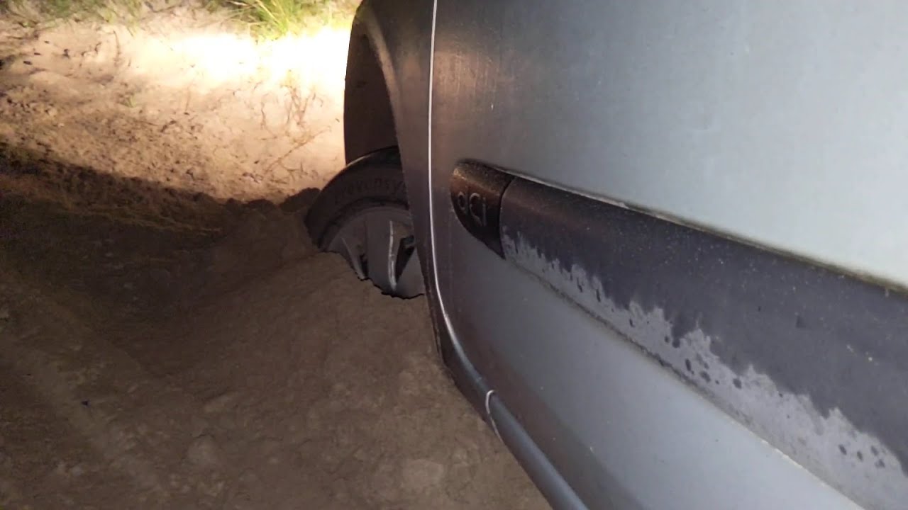 Renault Clio Car stuck deep in sand