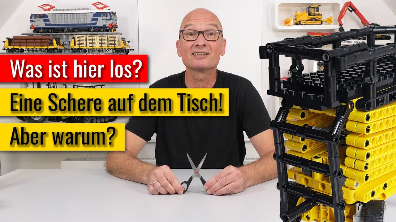 Was hat er denn jetzt gebaut? Und warum kommt eine Schere auf dem Tisch?