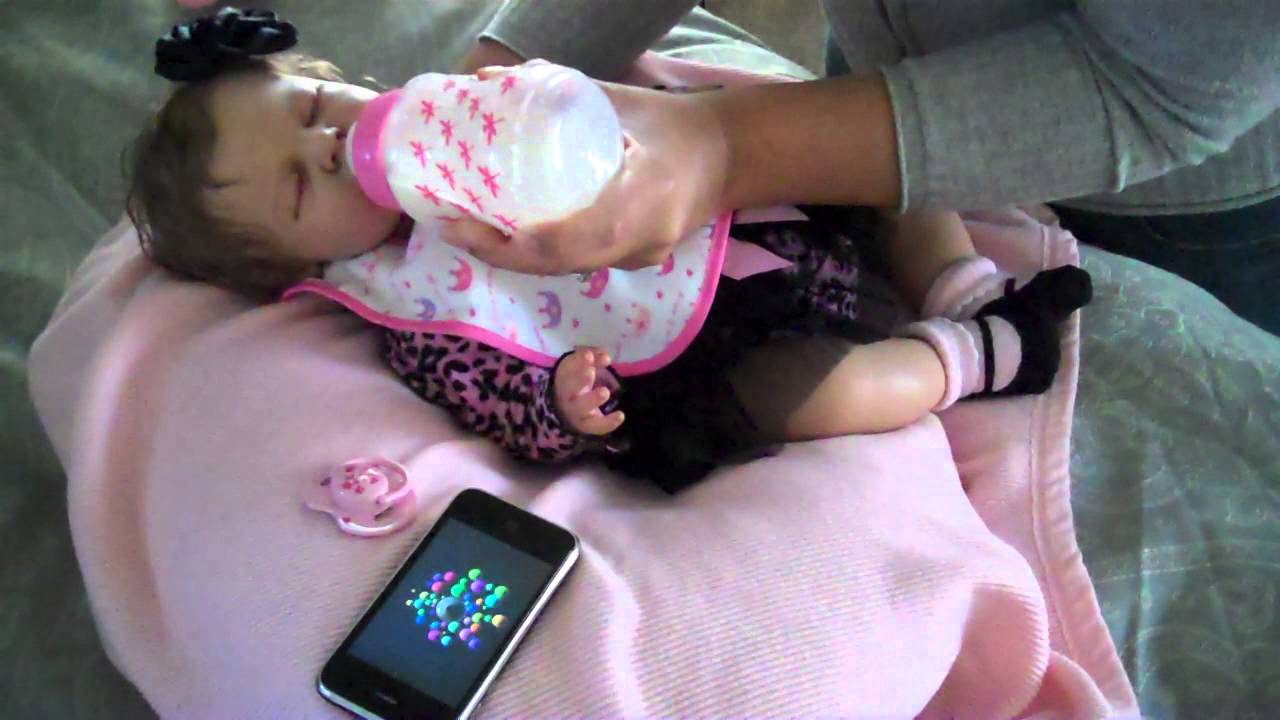 Feeding reborn Jasmine with Enfamil for the first time .