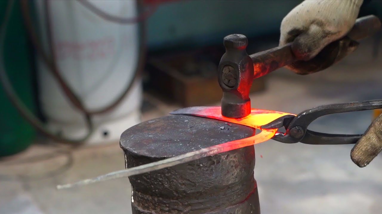 Process of Making traditional tools in a blacksmith's shop. craftsmanship of over 40 years.