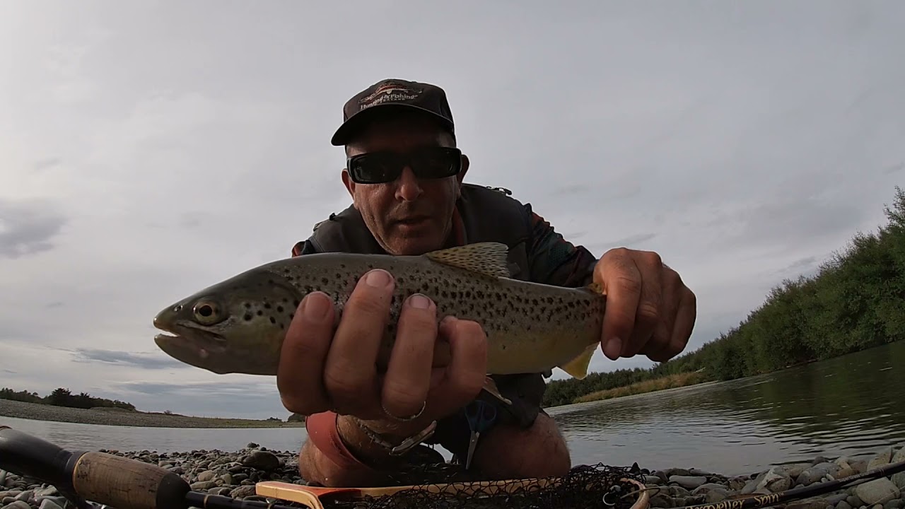 Sight fishing with a spin rod, Oreti River, Southland,NZ