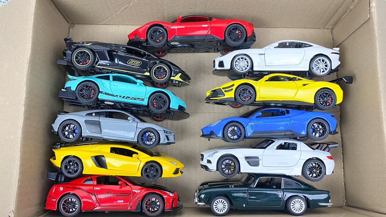 Box Full of Model Cars -Tesla Robotaxi, Tesla Cybertruck, Tesla Roadster, Lexus LC500, Lexus Lm 300h