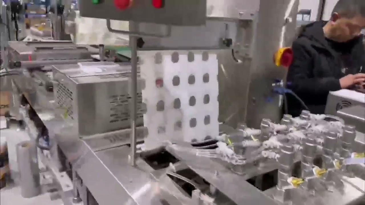 Automatic liquid filling and rigid film thermoforming packaging machine