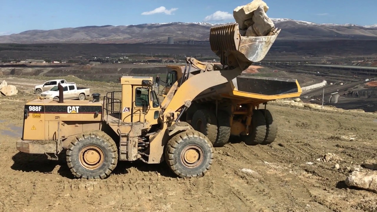 Caterpillar 988F Wheel Loader Loading Komatsu Dumpers - Labrianidis Mining Works