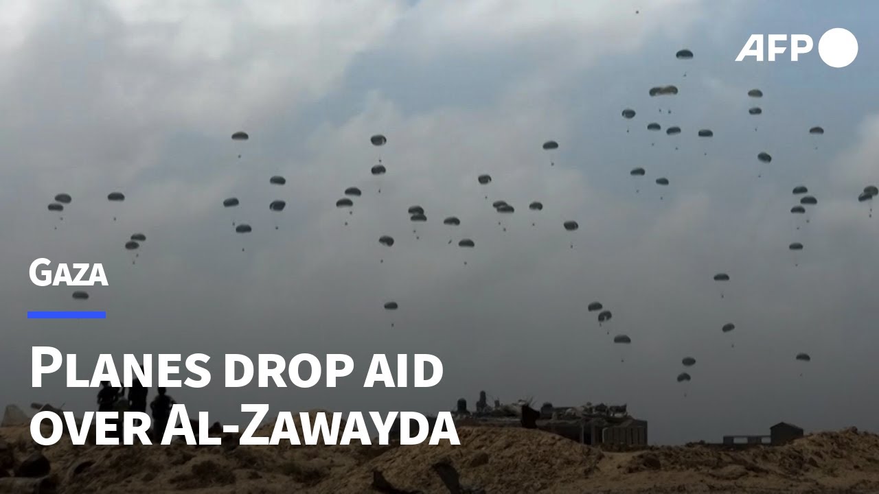 Parachutes fall during aid airdrop over the central Gaza Strip | AFP