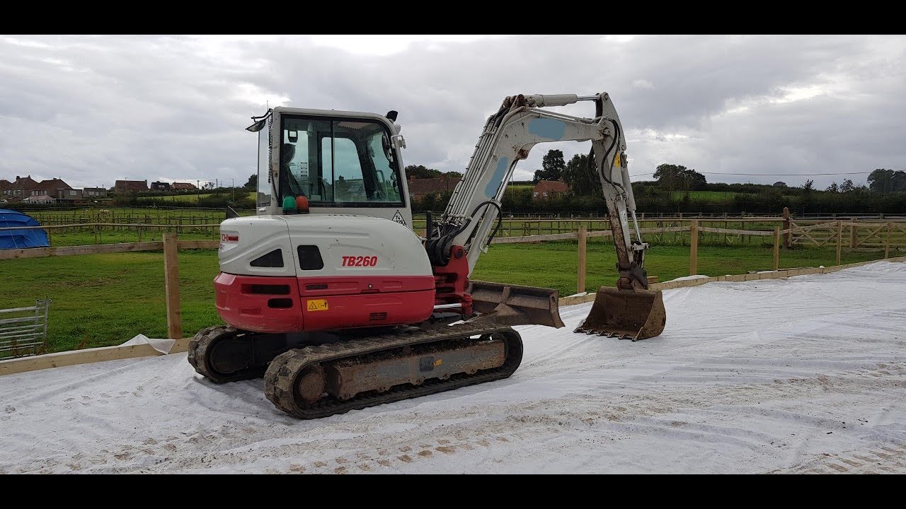 Takeuchi TB260 Digging out a pool and moving soil Part 2