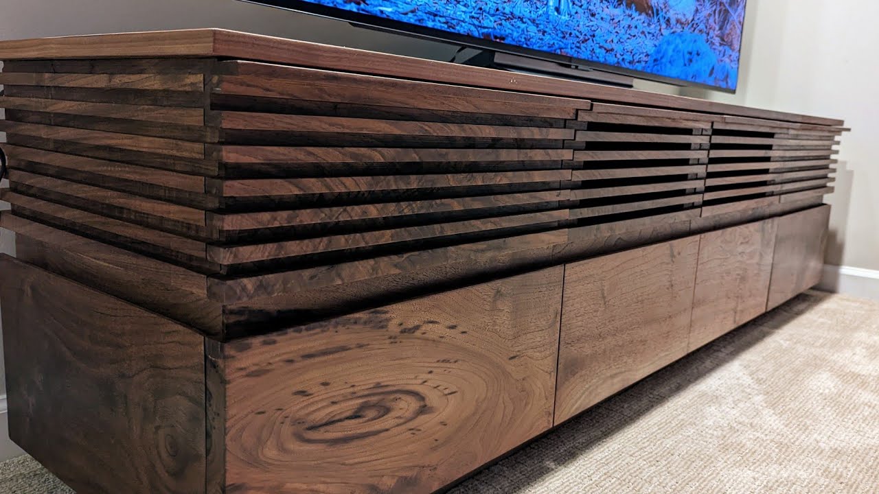 Custom walnut TV console with magnetic doors and 6 drawers