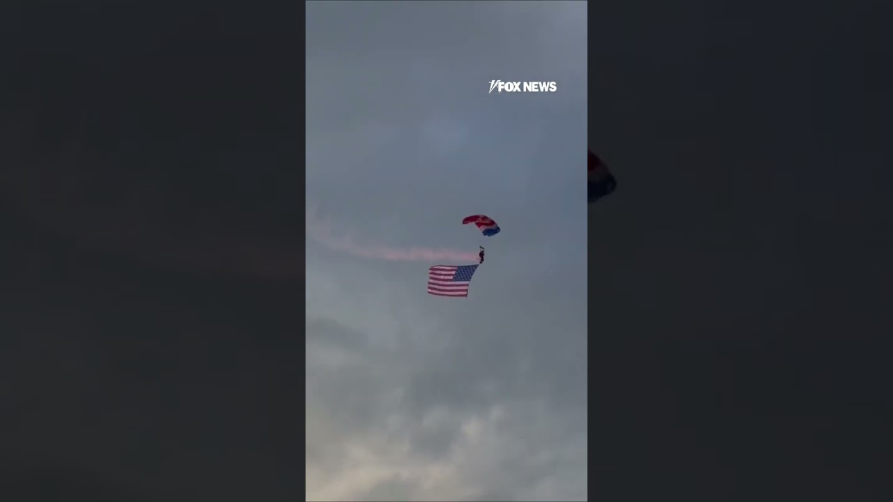 WATCH: Patriot parachute team soars GIANT American flags into Cody Stampede Rodeo