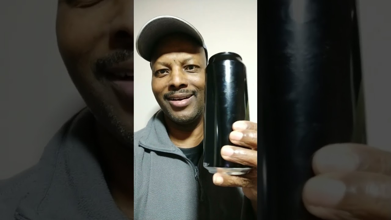 White Guy gives black beer to Black Guy