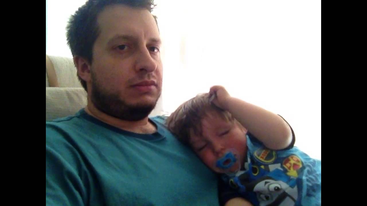 Dad waits for baby to fall asleep