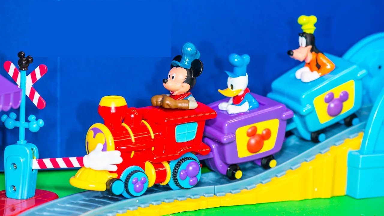 Family playing the Mickey Mouse Train and Track Playset