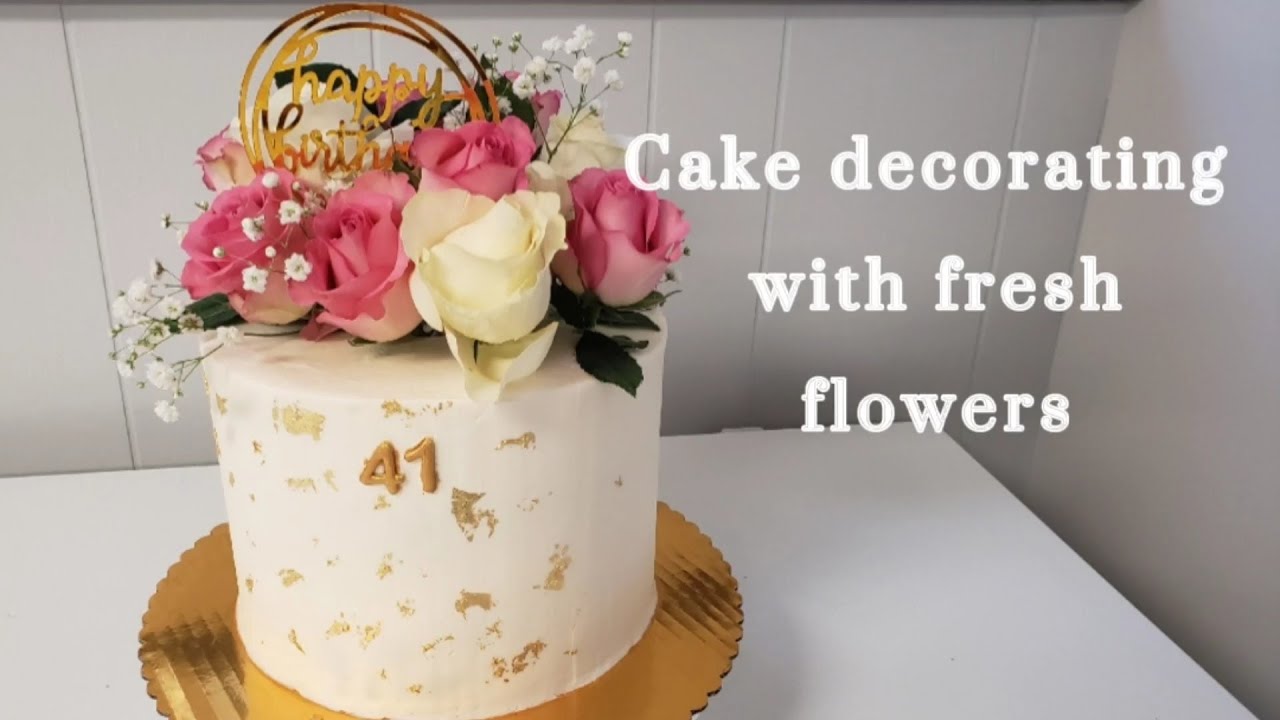 How to decorate a buttercream cake with fresh flowers