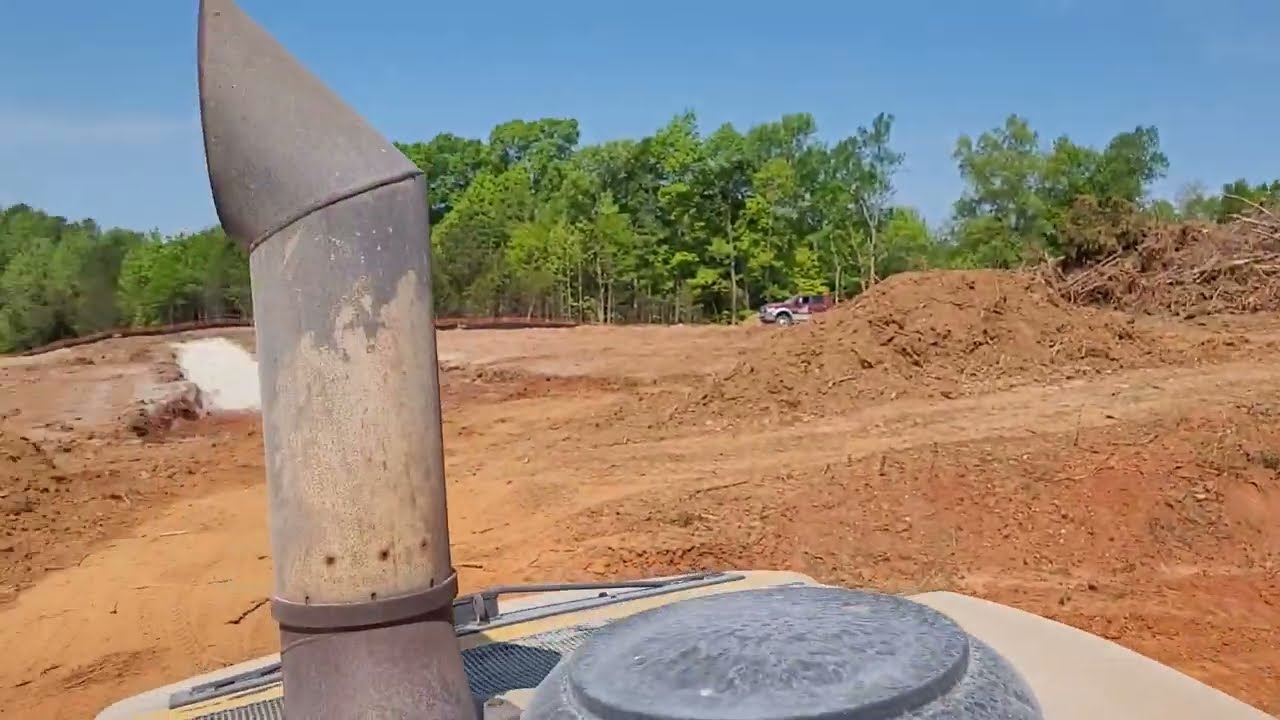 Mixing some bentonite clay to modify soil for retention pond with Caterpillar RM500 reclaimer.