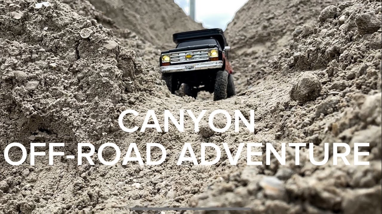 FMS Chevy K10 1:18 scale & FMS Toyota Hilux drive through Canyon. Will they make it to the top?