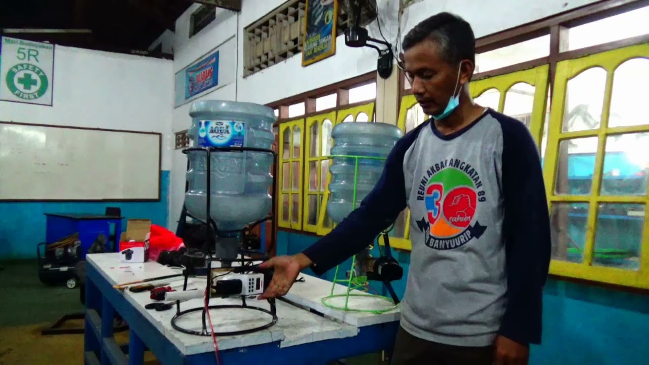 AUTO FEEDER ( PEMBERI PAKAN IKAN OTOMATIS)
