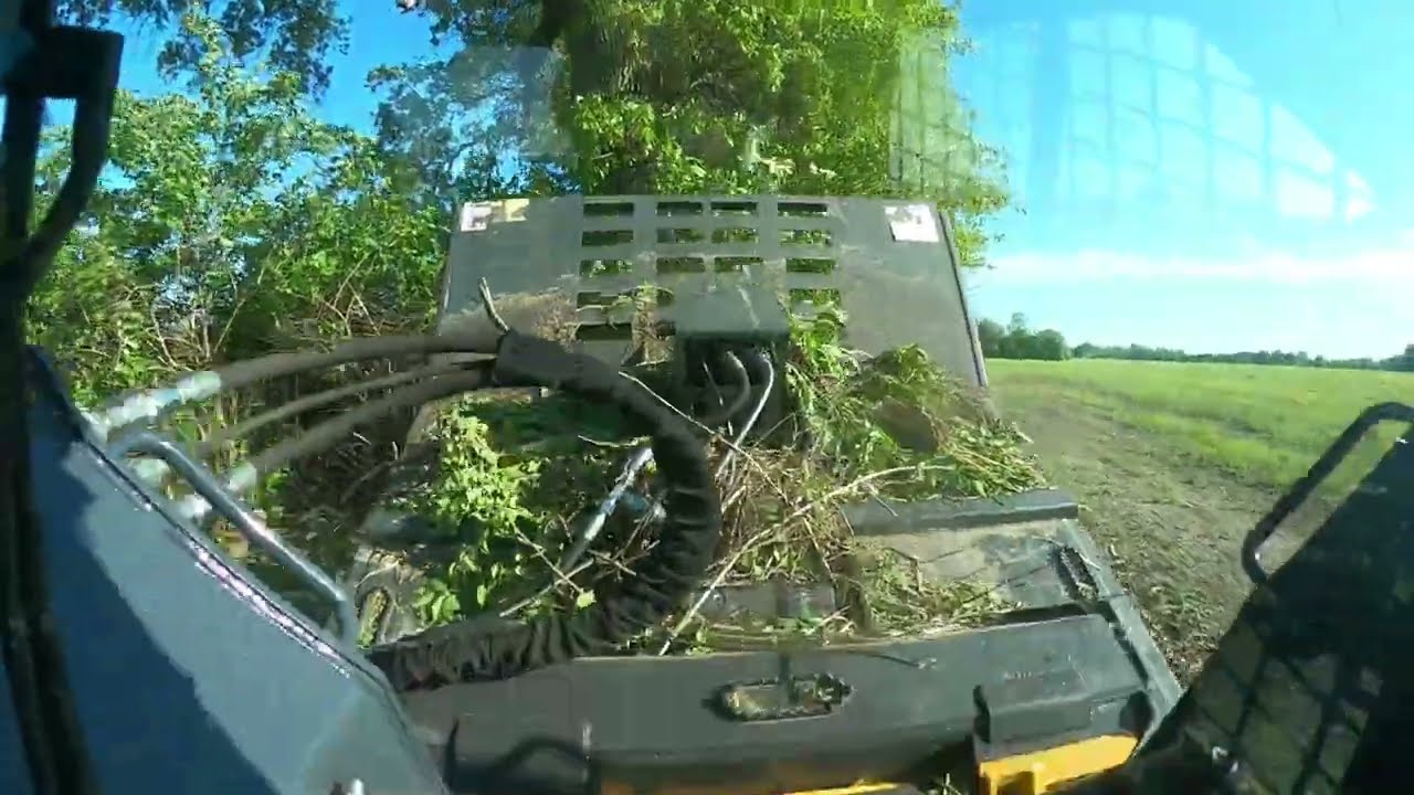 John Deere 325G with CID extreme brush cutter