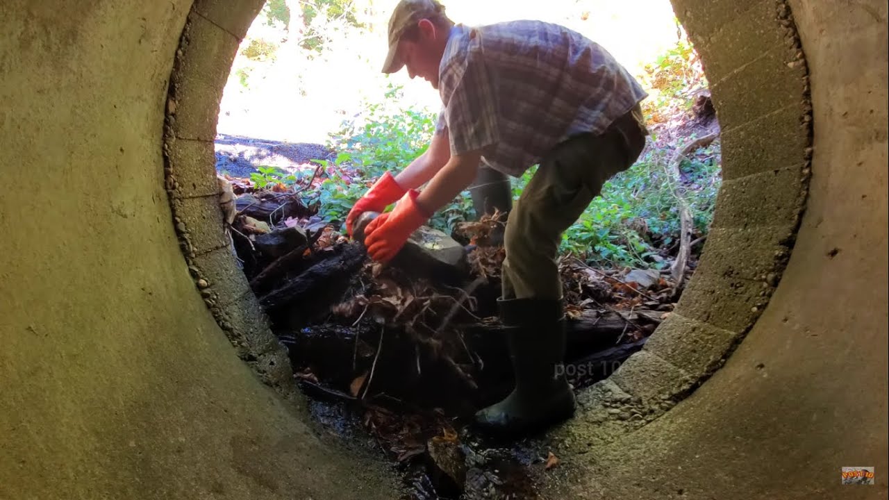 Unclogging Human Sized Culverts Clogged With Logs And Rocks
