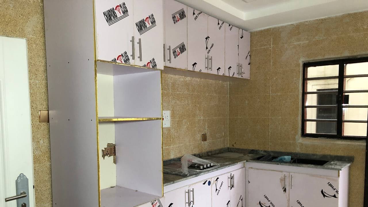 Price Of Kitchen Cabinet Made With Acrylic Wood And Accessories In Benin City, Edo State Nigeria.