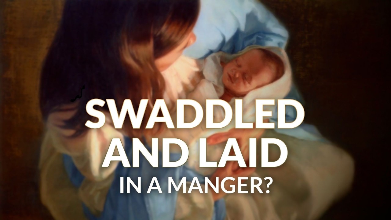 Why was Jesus swaddled and laid in a manger?