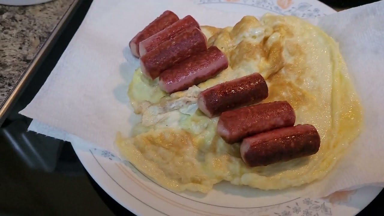 FRIED EGGS , CHICKEN SAUSAGES, AND FRIED FISH TAPA / TOCINO WITH TOMATOES