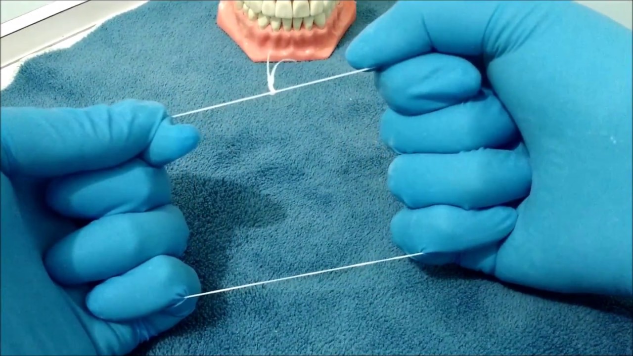COMO USAR EL HILO DENTAL