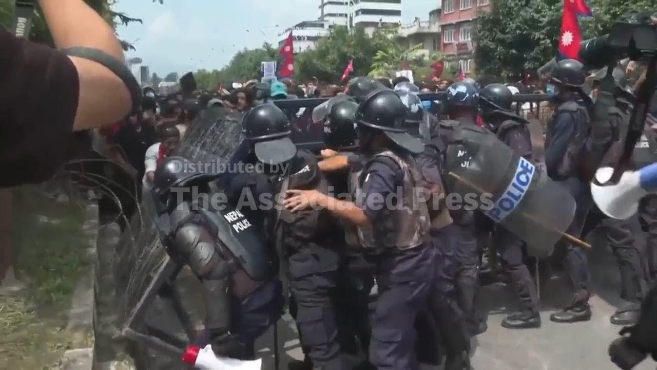 Protesters in Nepal surround parliament and clash with police as government blocks social media