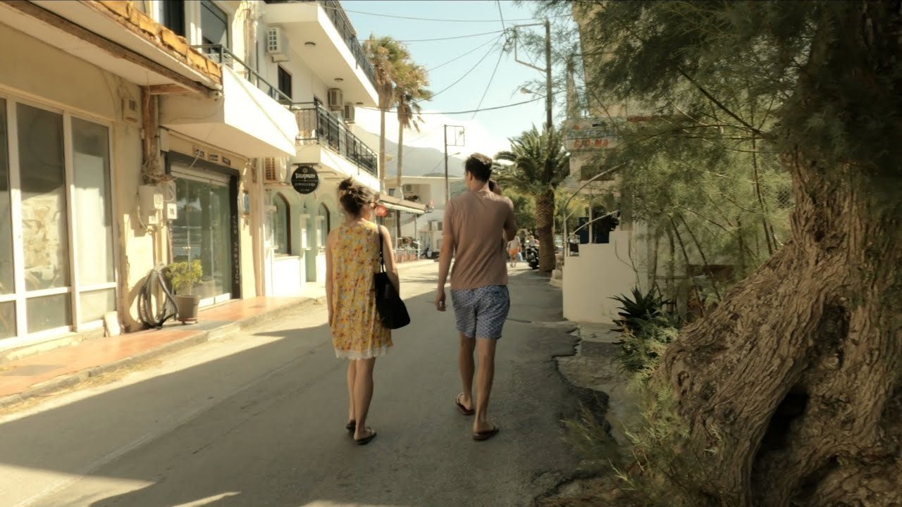 Summer walk in a beautiful Cretan coastal town Plakias, Greece
