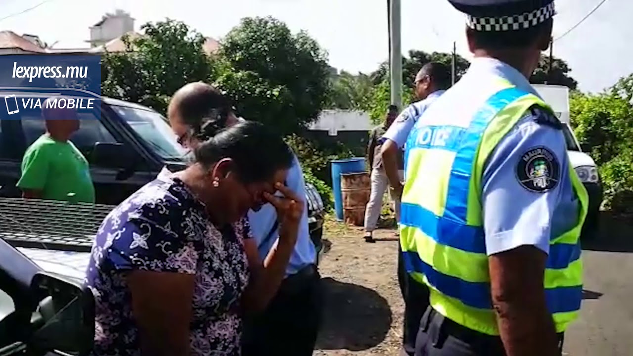 Meurtre à Petit-Raffray: la femme de la victime et la police sur place
