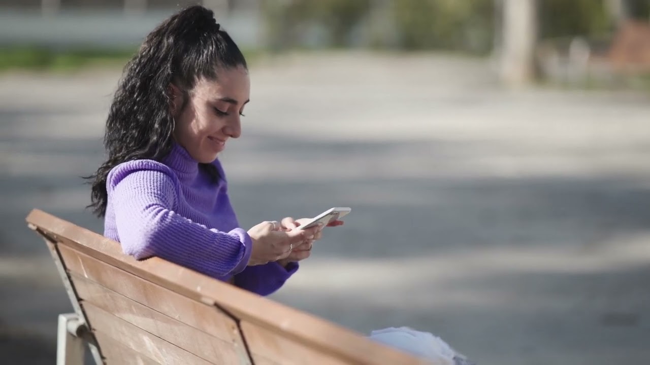 Woman Smiling And Texting