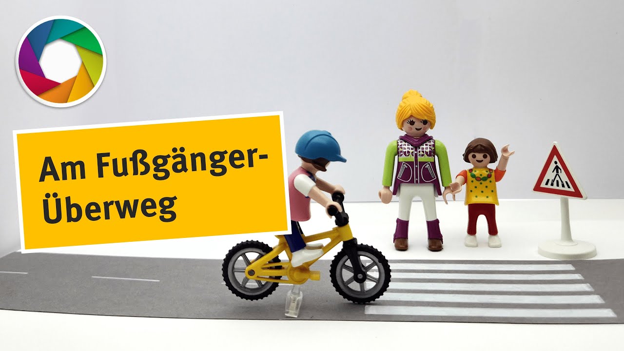 Mit dem Fahrrad am Fußgängerüberweg