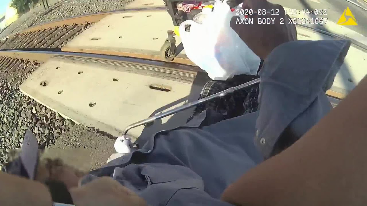 VIDEO: Lodi officer saves man in a wheelchair stuck in train tracks