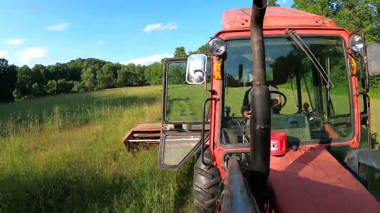 Mowing Hay with the Belarus 825 Tractor and the Hesston PT-7 Haybine...