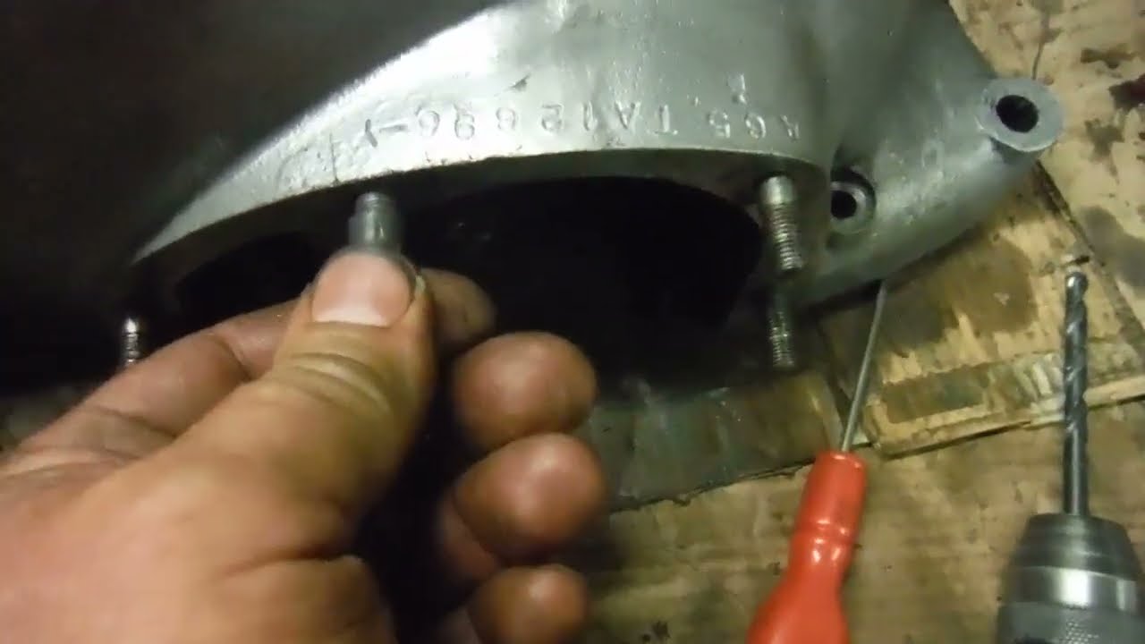 BSA A65 engine - that crankcase stud & hole, some plastic metal & some compacted under bed fluff!