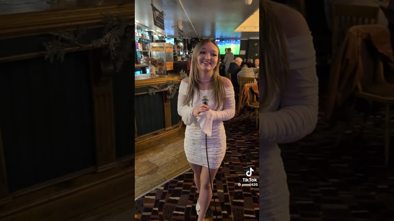 Girl singing don’t stop believing 