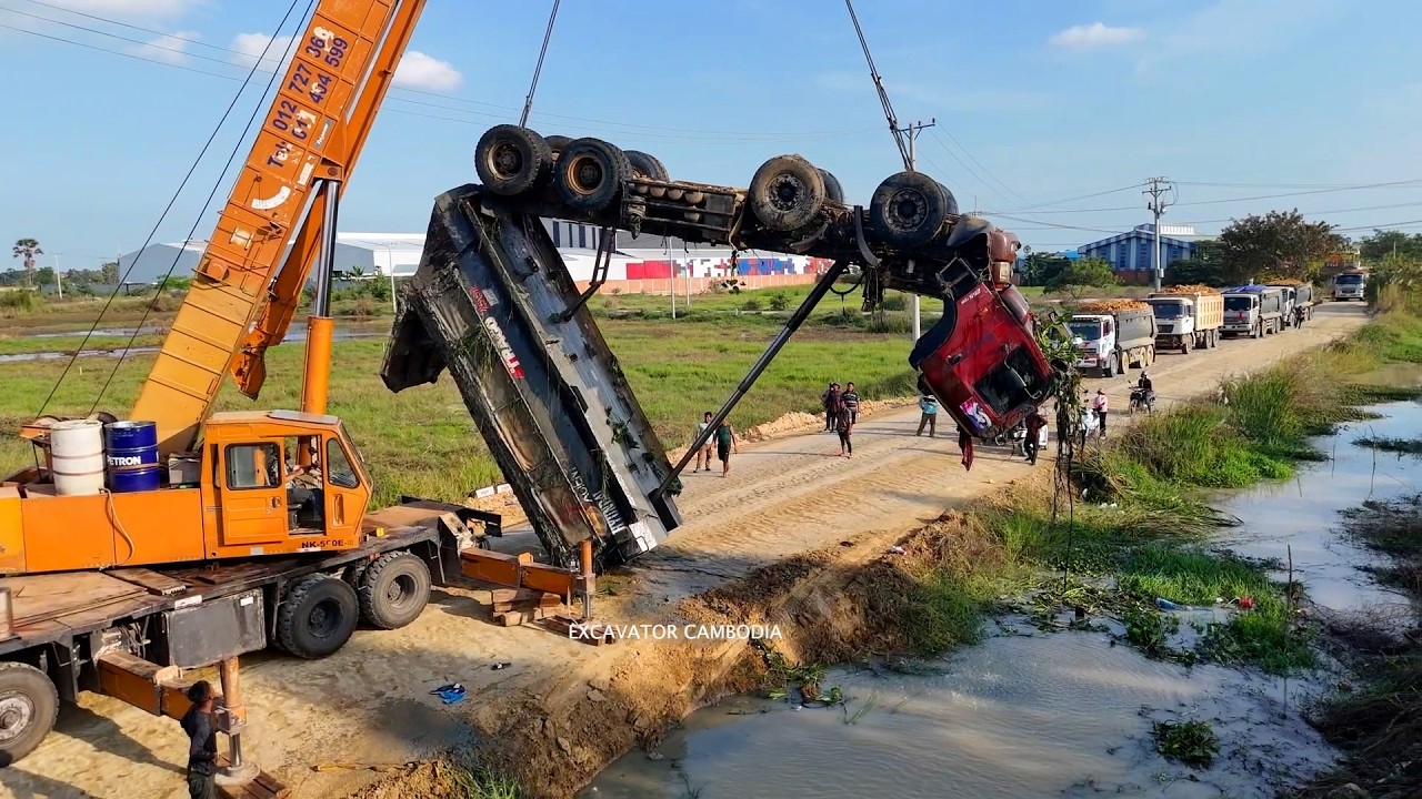 Be careful!!dump truck landslide overturned sink in canal and recovery by expert crane successfully