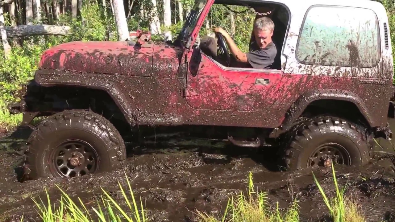 4 cylinder jeep in deep mud