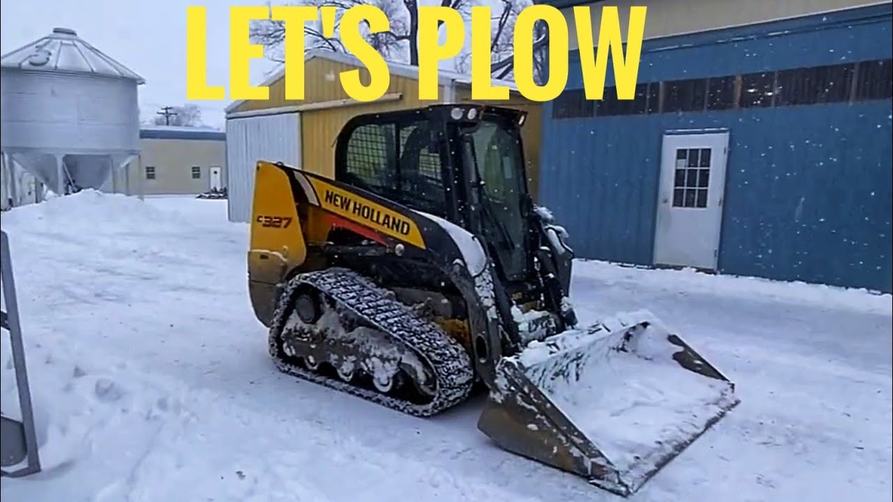 New Holland Skidsteer Plowing Snow