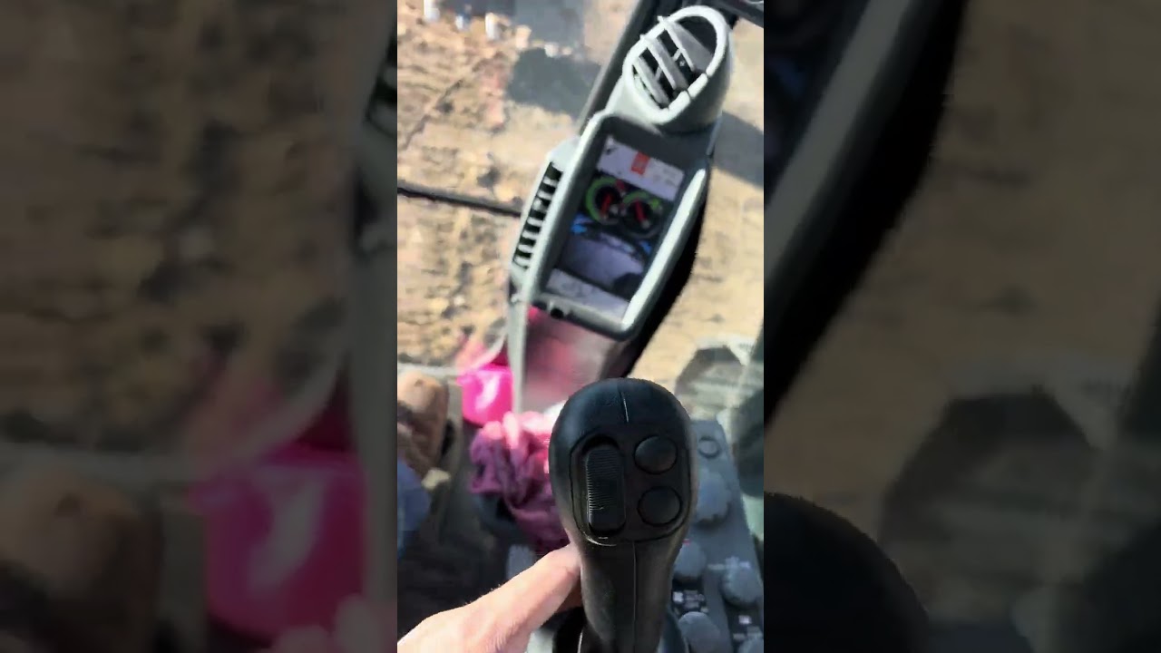 2D smart grade slope assist V ditch on a 2025 John Deere 210P excavator 