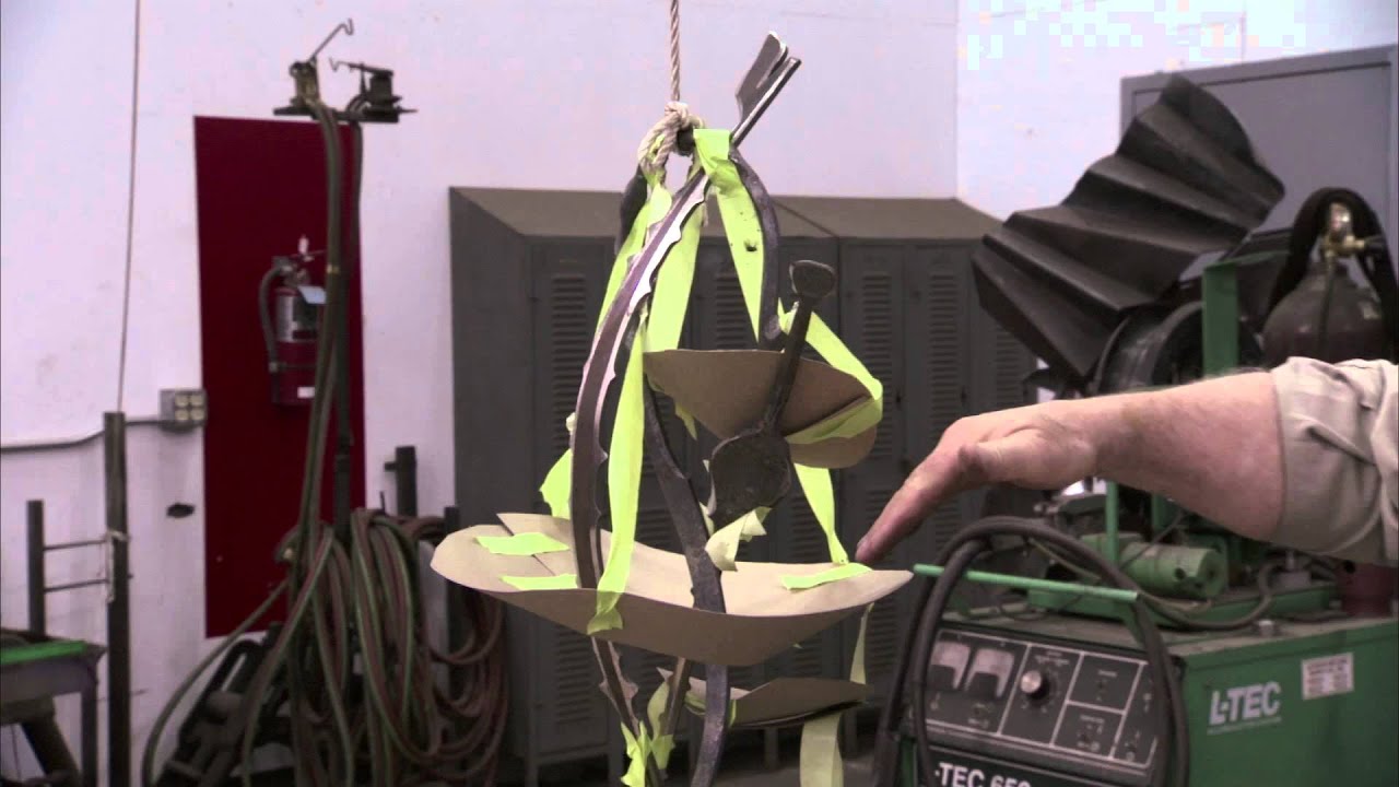 Albert Paley designs forged hardware and chandelier