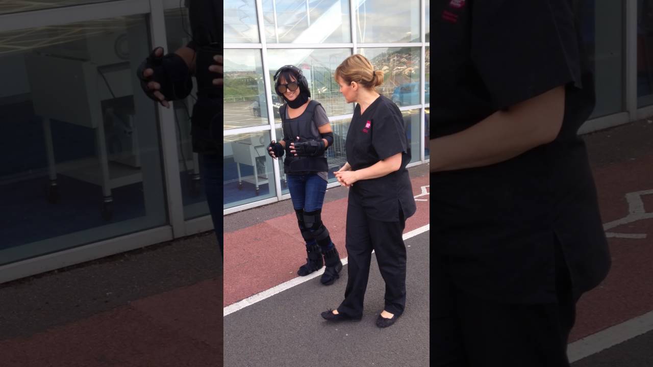 Newsreader Lucy Owen in age simulation suit.