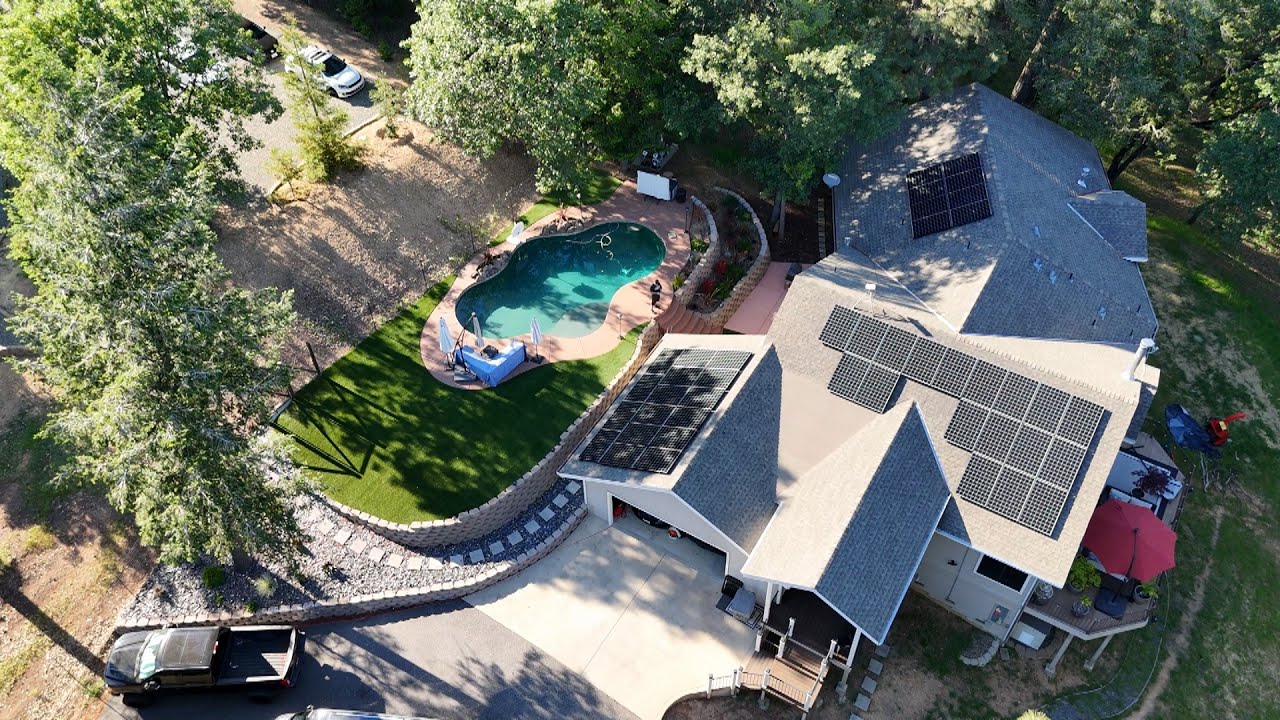 Backyard Makeover | Artificial turf, stamped concrete porch, plants, rocks, pavers retaining walls