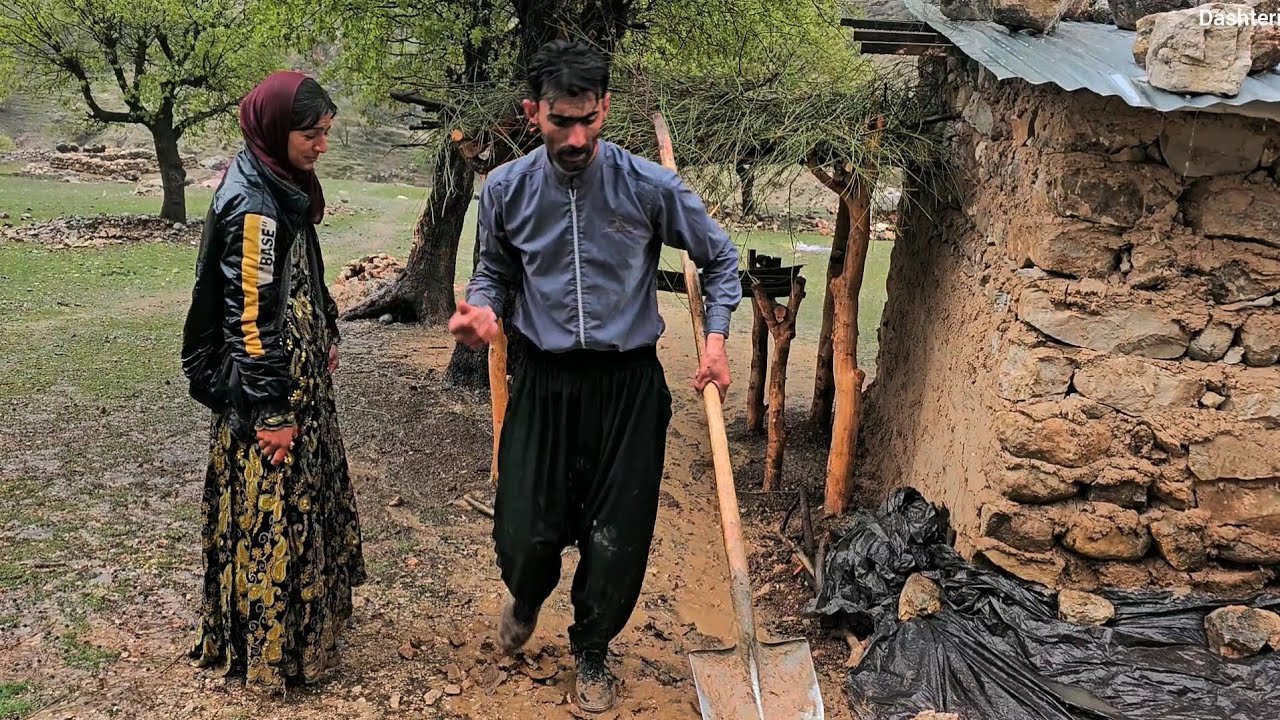 Terrible rain, Valila and Shaheen trying to keep the water from getting into the hut, and the rain 