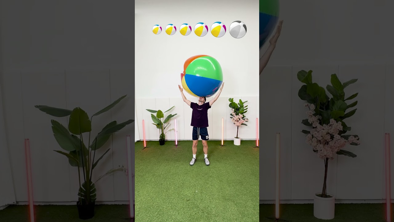 Holding Bigger And Bigger Beach Balls