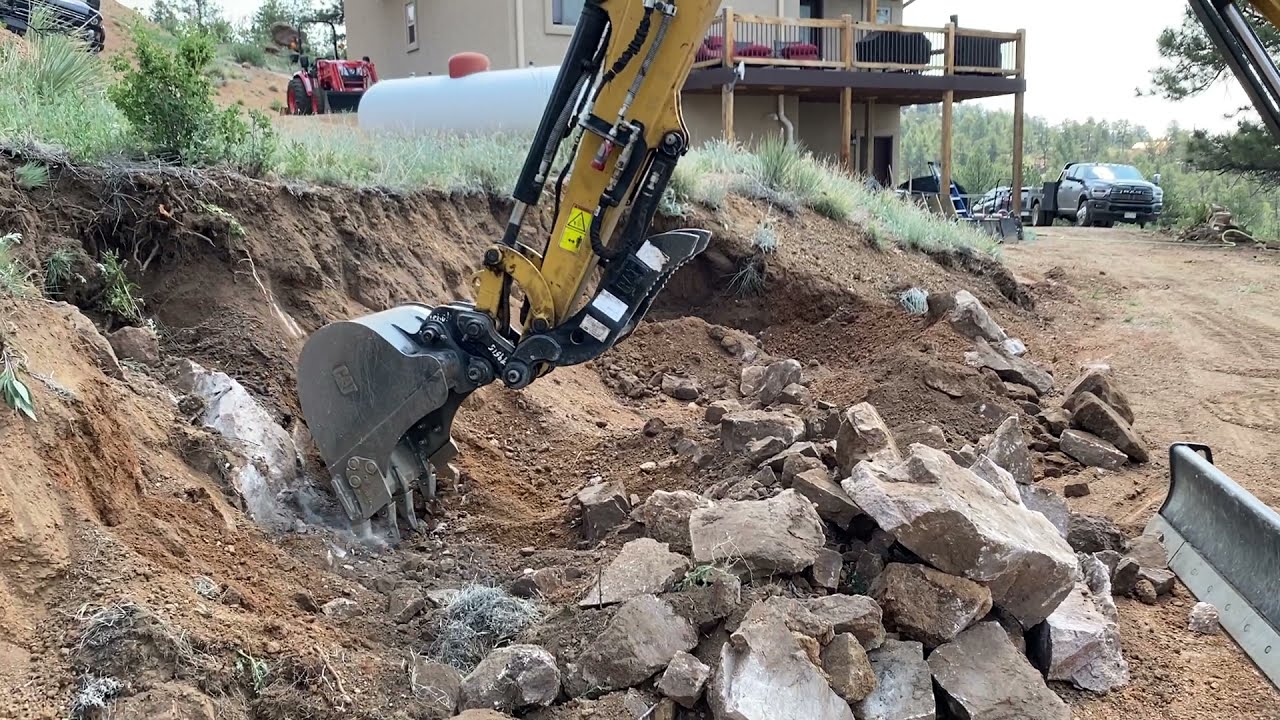 CAT 304E2 Mini Ex using Thumb Attachment