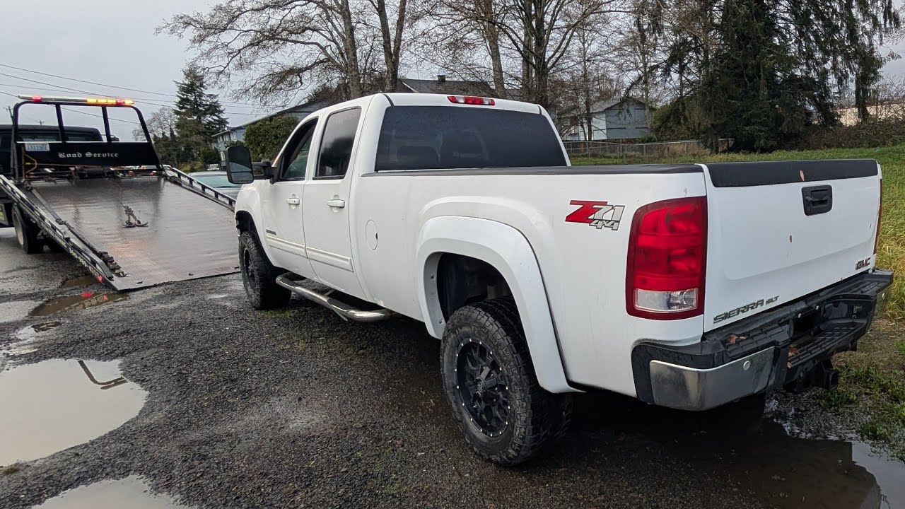 Totaled GMC Sierra 3500HD towed to IAA