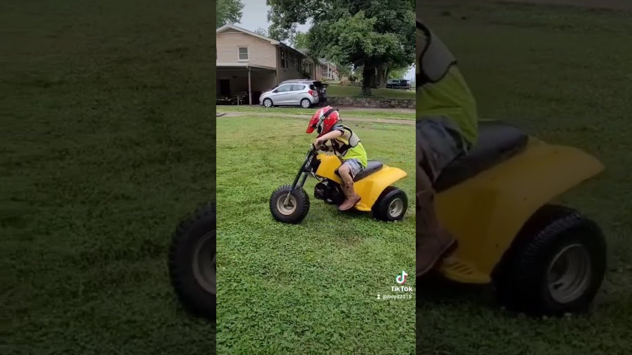 my son on his yamaha trizinger 60