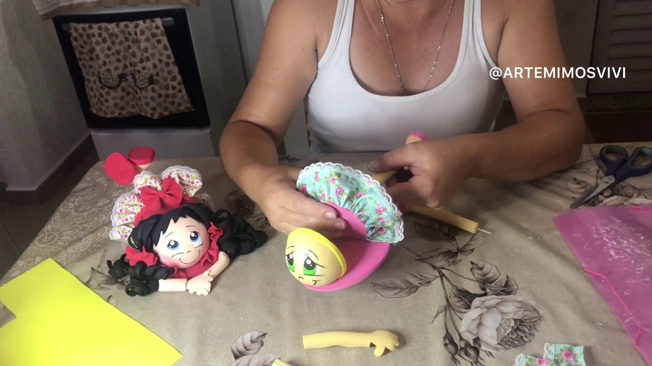 BONECA PORTA CELULAR